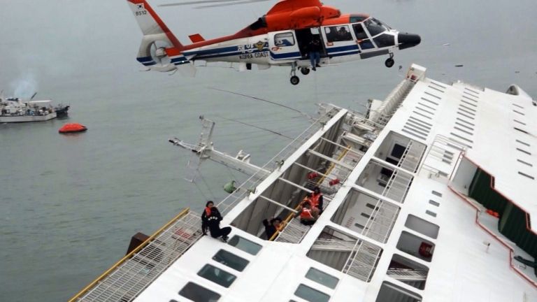 In this image taken from video released by News Y via Yonhap, passengers from a ferry sinking off South Korea's southern coast, are rescued by a South Korean Coast Guard helicopter in the water off the southern coast near Jindo, south of Seoul, Wednesday, 16 April 2014