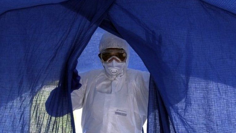 Cuban nurse Dalila Martinez enters a tent during a practice drill at a training camp for health workers fighting Ebola in Havana, Cuba, on 24 September, 2014