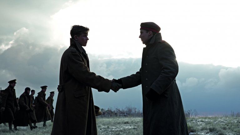 Two soldiers shaking hands