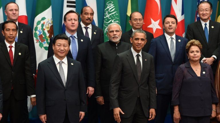 China's President Xi Jinping (front L) stands next to US President Barack Obama (front C) as they pose for the "family photo" of world leaders during the G20 Summit in Brisbane