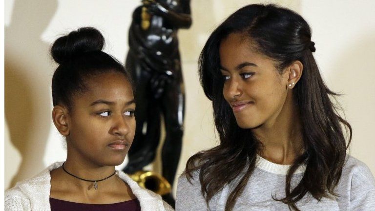 Sasha and Malia Obama listen to their father at the National Thanksgiving Turkey pardoning at the White House in Washington
