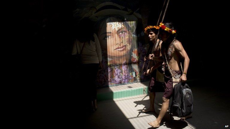 Indians walk through a tunnel at UN conference in Peru Nov 2014