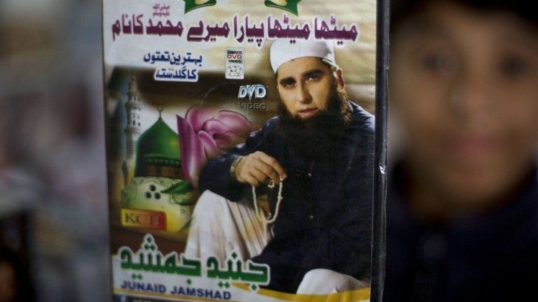 A vendor shows a DVD of Pakistan's Junaid Jamshed at a stall in Islamabad, Pakistan, Wednesday, Dec. 3, 2014.