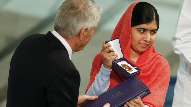 Nobel Peace Prize laureate Malala Yousafzai receives the medal and the diploma during the Nobel Peace Prize awards ceremony at the City Hall in Oslo, 10 December 2014