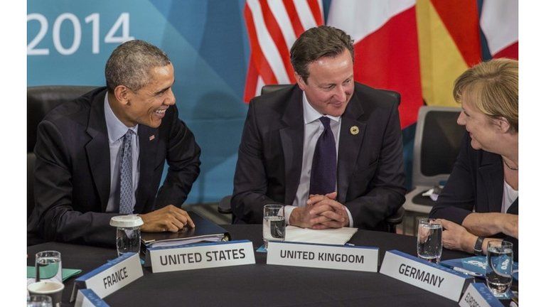 U.S. President Barack Obama and Britain"s Prime Minister David Cameron listen to Germany"s Chancellor Angela Merkel as they attend the Transatlantic Trade and Investment Partnership (TTIP) meeting at the G20 the G-20 leaders summit in Brisbane, Australia, Sunday, Nov. 16, 2014