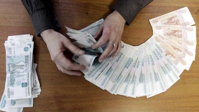 Man counting roubles