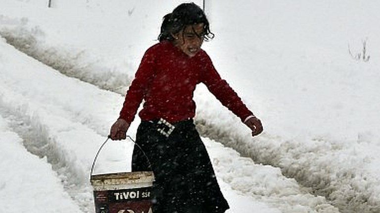Young girl in snow, Bekaa Valley, Lebanon (07/01/15)
