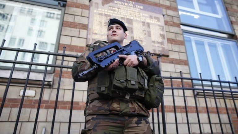 A French soldier secures the access to a Jewish school in Paris, 14 January 2015