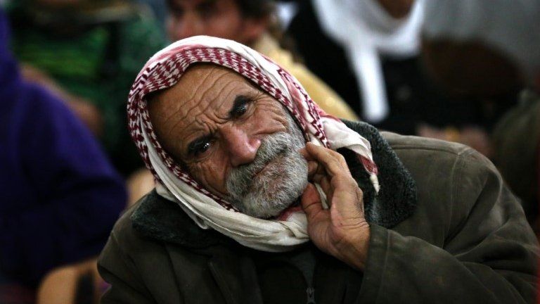 A Yazidi man rests at Al-Tun Kopri health centre, located half way between the northern Iraqi city of Kirkuk and Arbil
