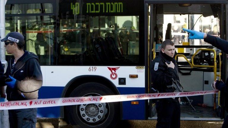 Police outside the bus following the attack, 21 January 2015