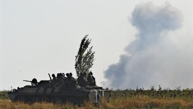 Ukrainian army vehicle and rebel shellfire in Mariupol, September 2014