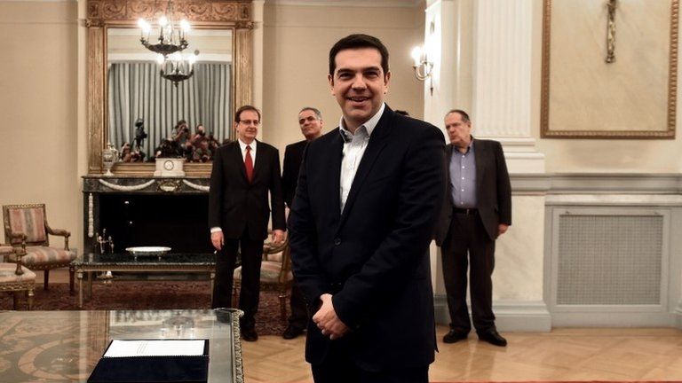 Alexis Tsipras smiles after being sworn in as prime minister of Greece, 26 January