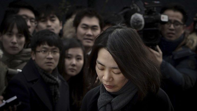 Heather Cho appears in front of the media in Seoul December 12, 2014