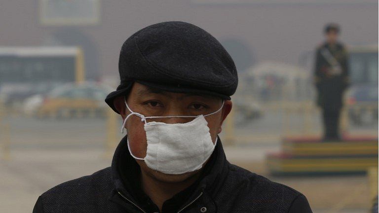Man wearing a mask in Tiananmen