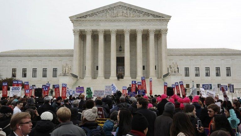 Demonstrators in favor of Obamacare gather at the Supreme Court building in Washington 4 March 2015