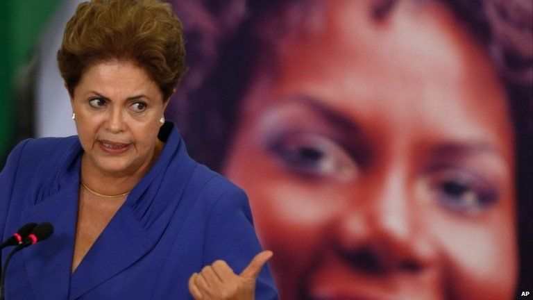Brazil's President Dilma Rousseff speaks during a signing ceremony for a harsher law against femicide, at the Planalto Presidential Palace in Brasilia, Brazil, Monday, March 9, 2015.