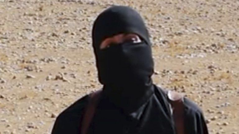 Screen grab from Islamic State footage showing Mohammed Emwazi wearing a mask, dressed all in black