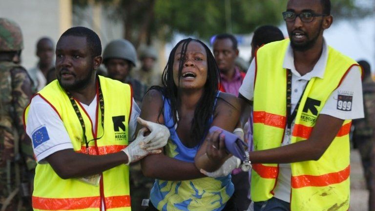 A woman reacts as she is rescued out of the building where she had been held hostage as Kenyan soldiers entered the university building after a fierce fights with attackers at the Garissa University in Garissa town, 2 April 2015