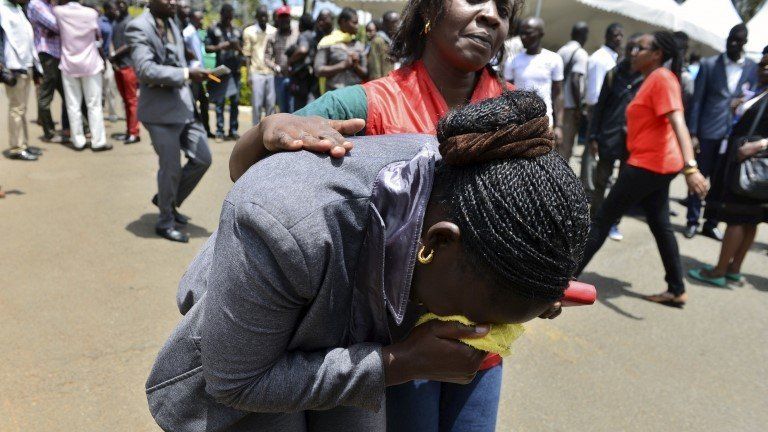 Relative being comforted by Red Cross staff at Chiromo Mortuary in Nairobi, 3 April 2015