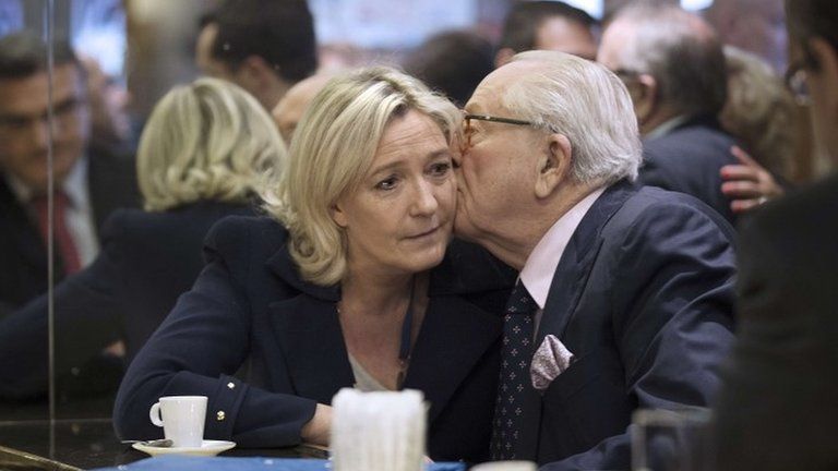Jean-Marie Le Pen kissing his daughter Marine