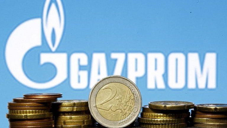 Gazprom logo and euro coins