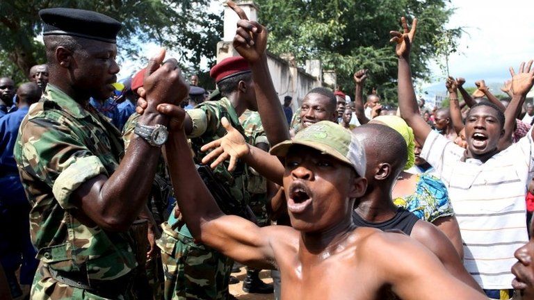 Protesters celebrate with troops in Bujumbura, 13 May
