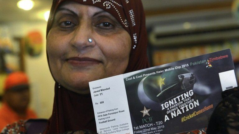 A Pakistani cricket fan holds tickets for the Pakistan and Zimbabwe cricket series after purchase at a shopping mall in Lahore on May 16, 2015.