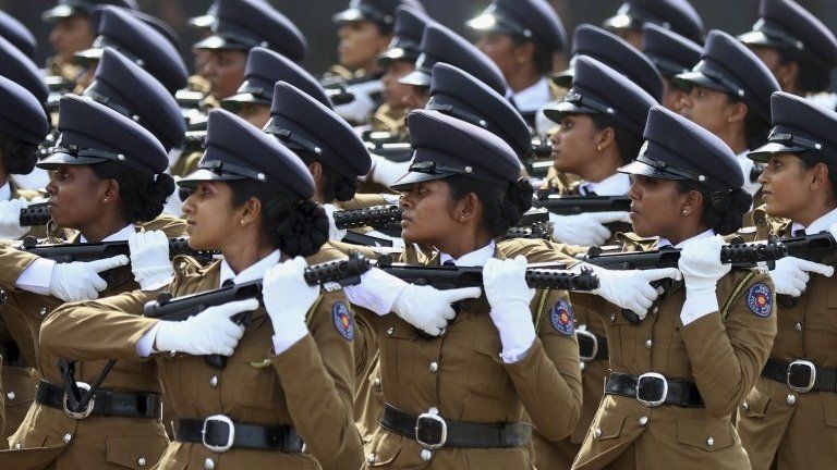Sri Lankan women police officers march during a Victory Day parade in Matara, about 165 kilometers (103 miles) south of Colombo, Sri Lanka, Tuesday, May 19, 2015.