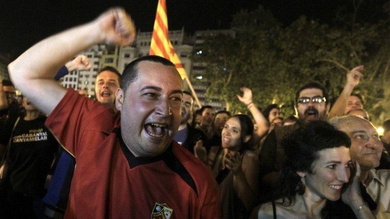 People celebrate the results of leftist parties at the townhall square after the Spanish regional and local elections in Valencia, Spain, 25 May 2015.