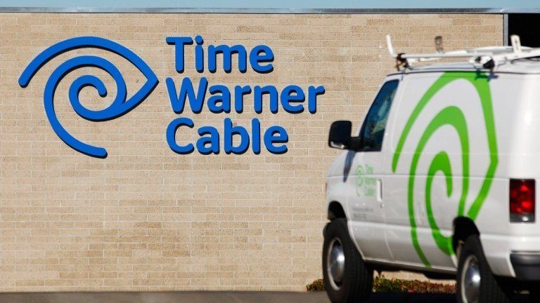 Time Warner sign and van
