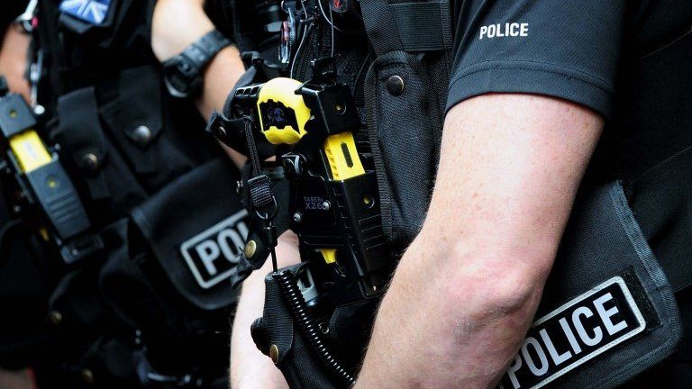 British police officer armed with a Taser