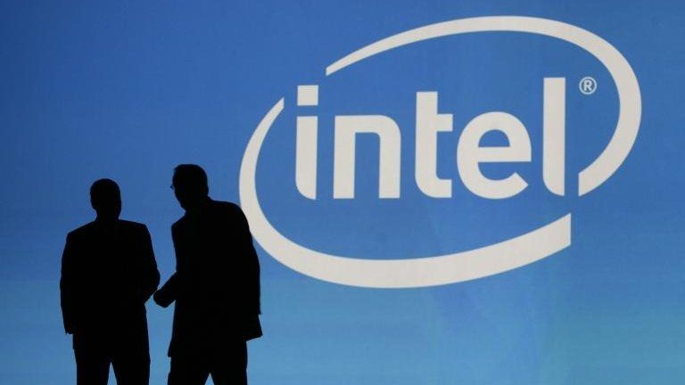 People in front of Intel logo