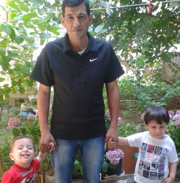 Abdullah Kurdi with his two sons Aylan and Galip