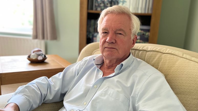 MP Sir David Davis pictured sitting in an armchair