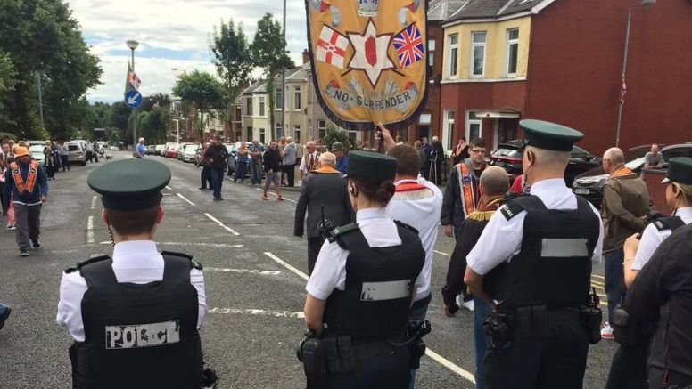 Members of the three lodges involved in the Ardoyne parade dispute arrived at police lines 