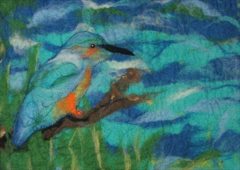 A picture of a kingfisher made from different coloured felt