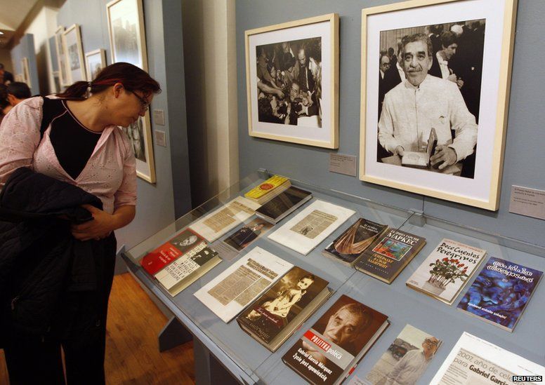 A woman looks at books and articles on Colombian Nobel Prize-winning writer Gabriel Garcia Marquez during the opening day of "A Life", an exhibition about Marquez's life and his literary works, at the Palace of Fine Arts in Mexico City October 8, 2009.