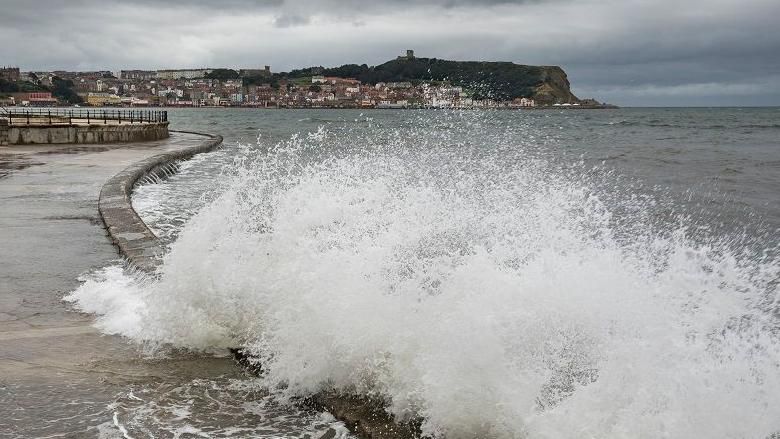 Waves hitting coast in Scarborough, north Yorkshire