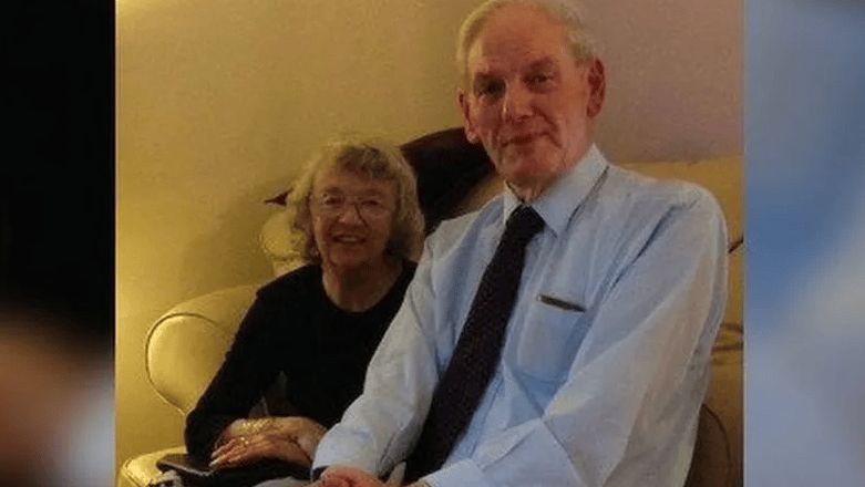 John Rees on right, wearing shirt and tie, with wife Eunice beside him