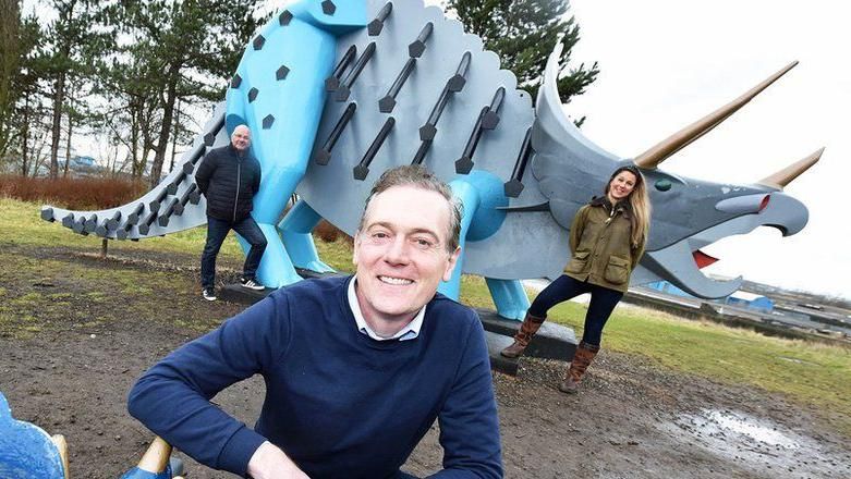 Former Middlesbrough mayor Andy Preston and councillors in front of a steel dinosaur