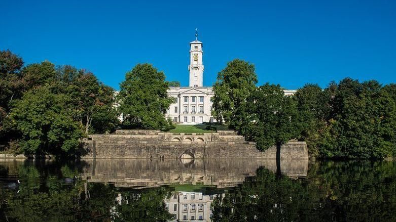 A view of the University of Nottingham building in front of Highfield lake 