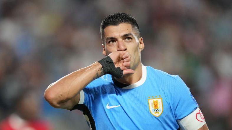 Uruguay's Luis Suarez kisses his hand in celebration