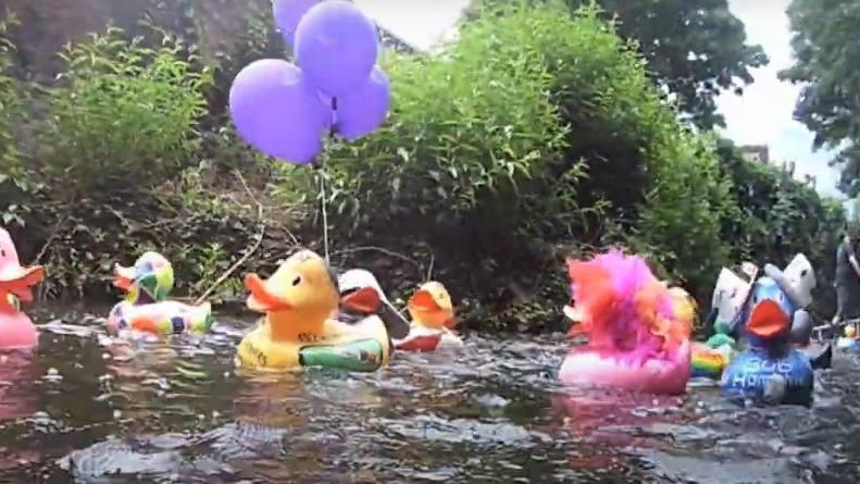 Decorated ducks on a river