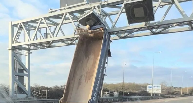 picture shows lorry bed wedged under gantry 