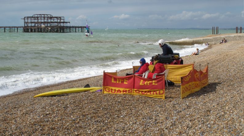 Lifeguards watching over a wind Brighton Beach and West Pier