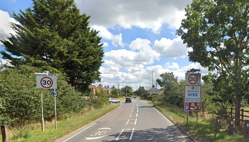 Road into Diss with 30mph signs and Welcome to Diss sign 