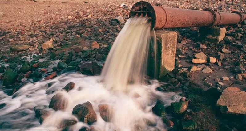 Water pouring out of a pipe