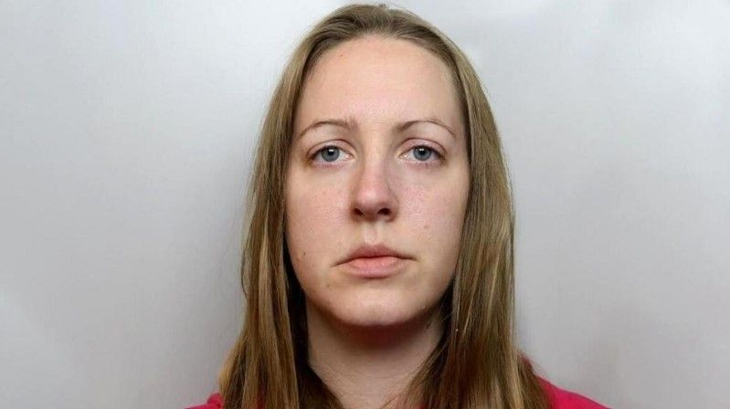 Lucy Letby, with shoulder length blonde hair and a red jumper, is pictured for her police mugshot 