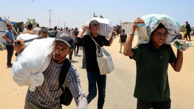 Palestinians say local gunmen and Israeli forces opened fire near Gaza aid site