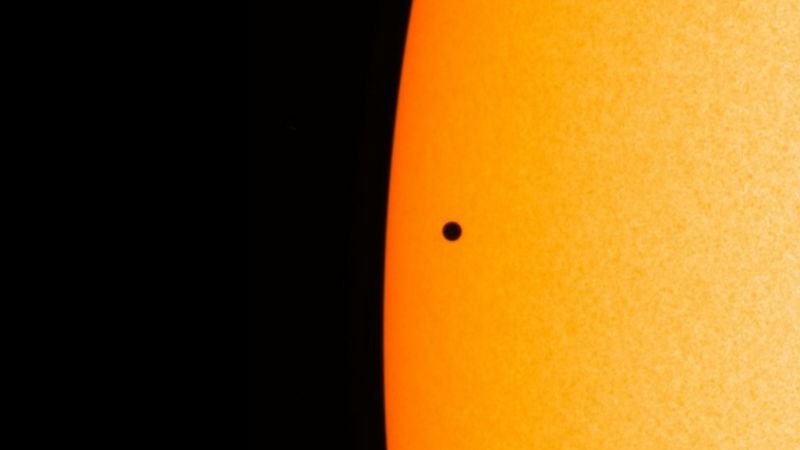 Silhouette of Mercury against the bright surface of the sun